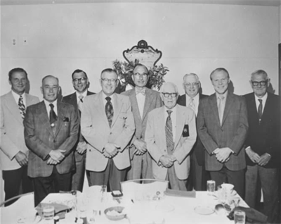 Former Cheyenne Mayors (from L-R): Ben Nelson, Worth Story, Jim Van Velzor, Floyd Holland, R.E. Cheever, unidentified man, Herb Kingham, Bill Nation, and Val Christensen